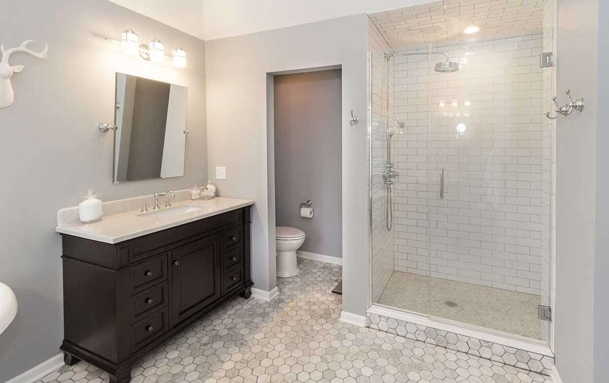 Elegant tile work for the shower base and walls in a luxury walk-in shower