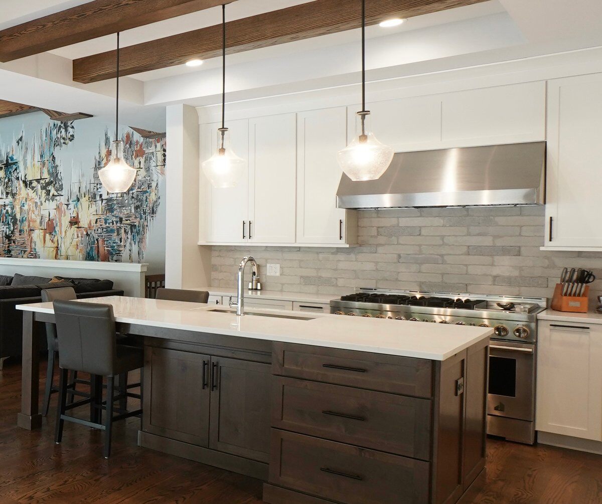 A seated kitchen desk integrated into a larger kitchen island. 