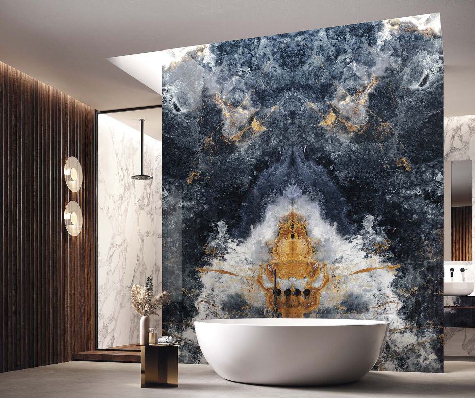 Stand alone tub with a beautiful art piece behind it that stretches to the ceiling