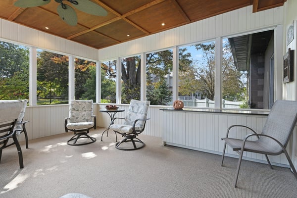 Luxurious and contemporary sun room with lots of seating area to enjoy the natural light