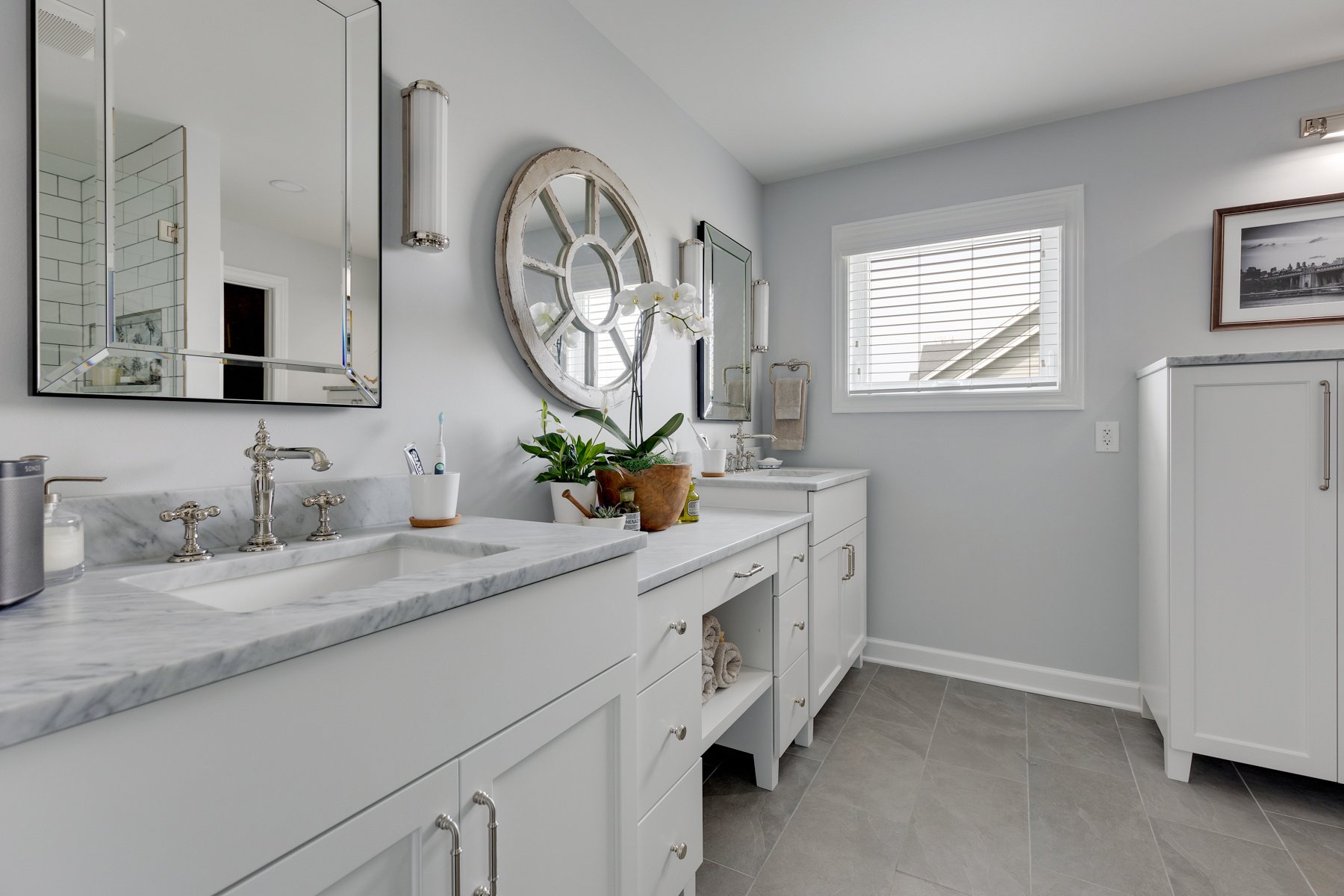 All white bathroom with marble countertops