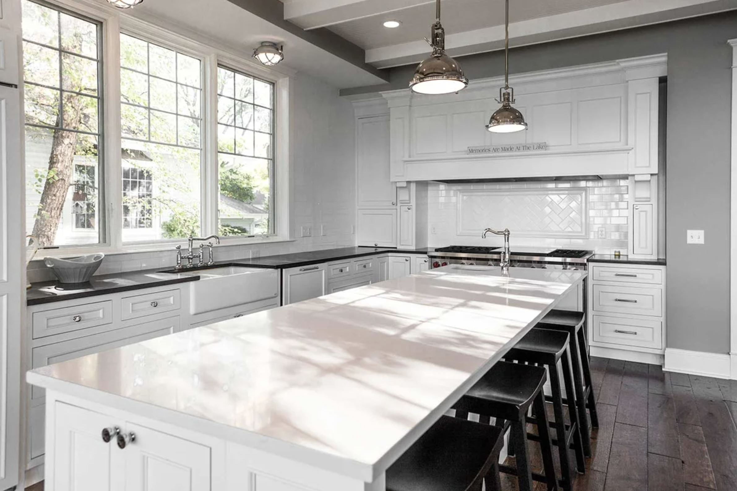 A large and open kitchen counter top island, perfect for preparing food and entertaining guests