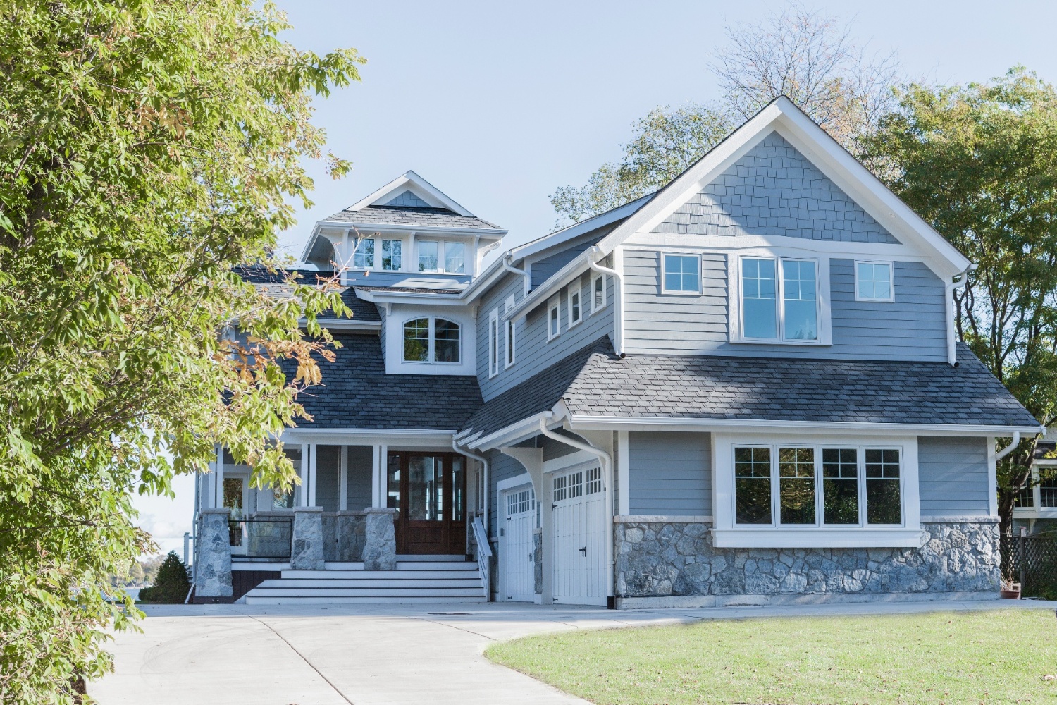 family lake home with a second story addition on top