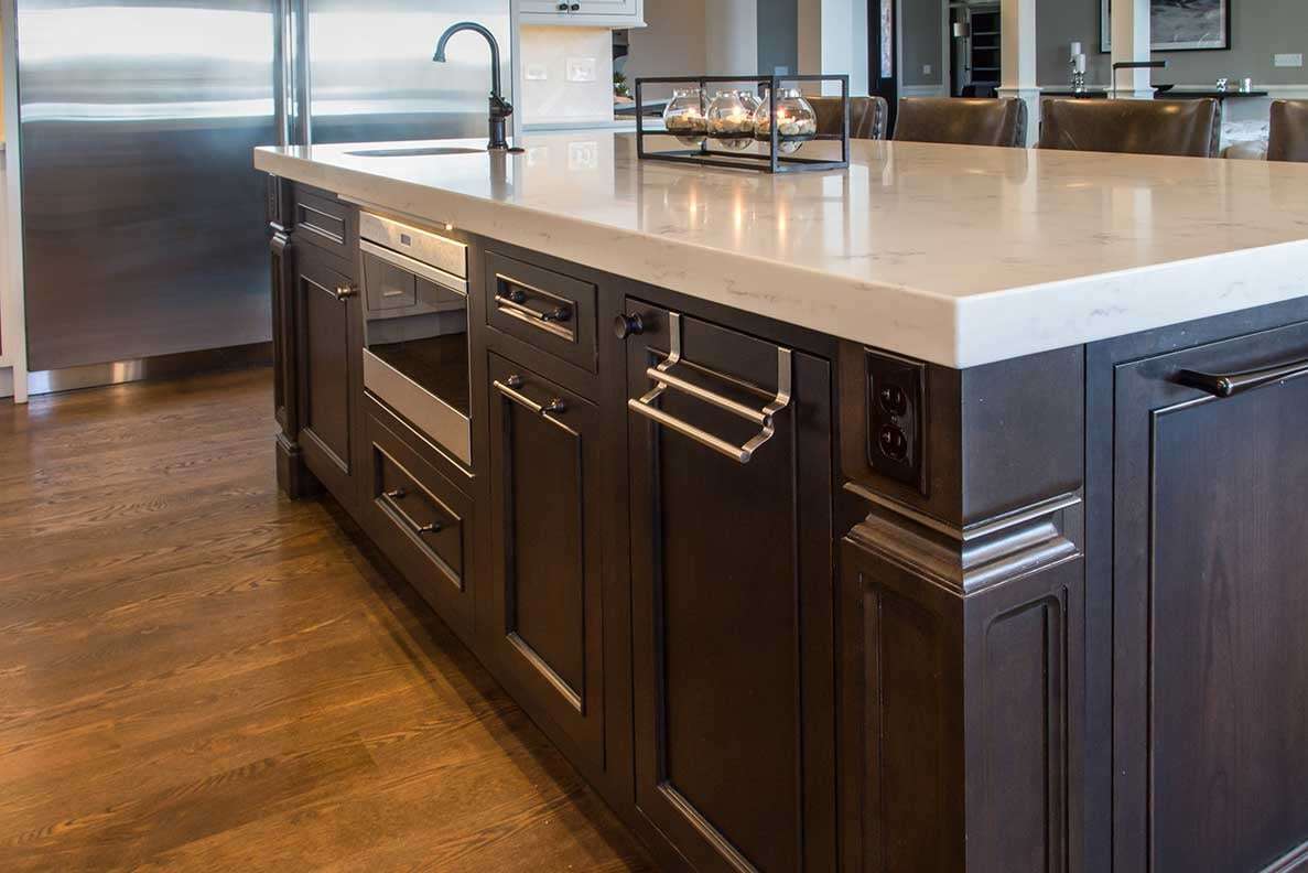 Aesthetic kitchen island with dark wood stain and silver finishes