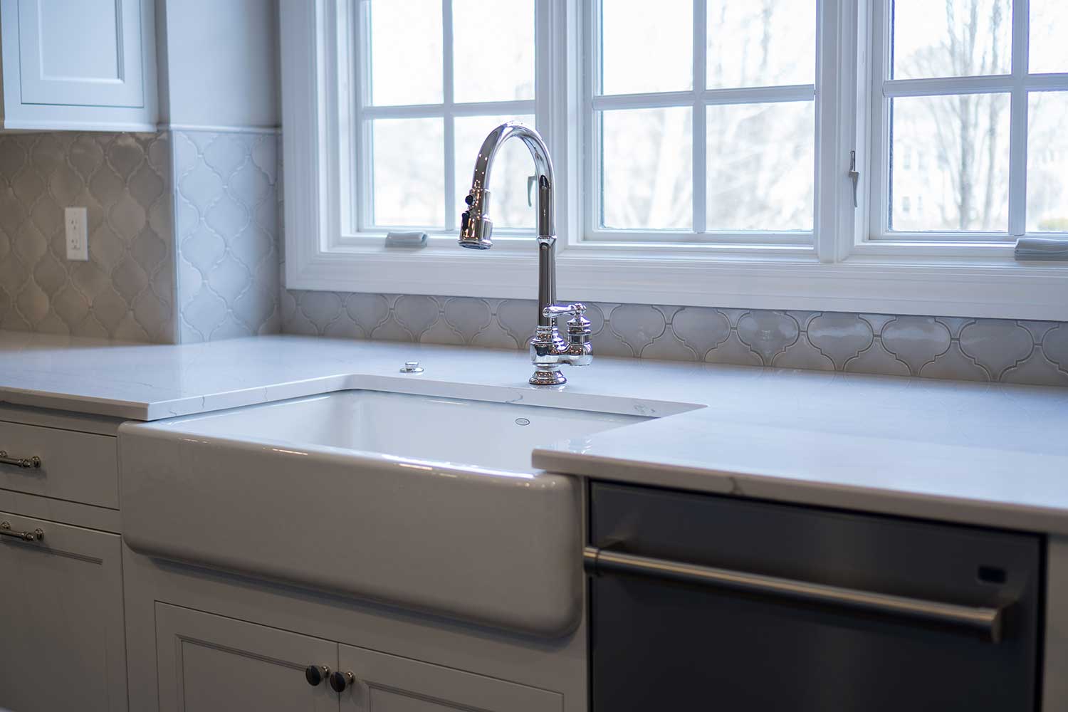 kitchen sink with laminated quartz countertop